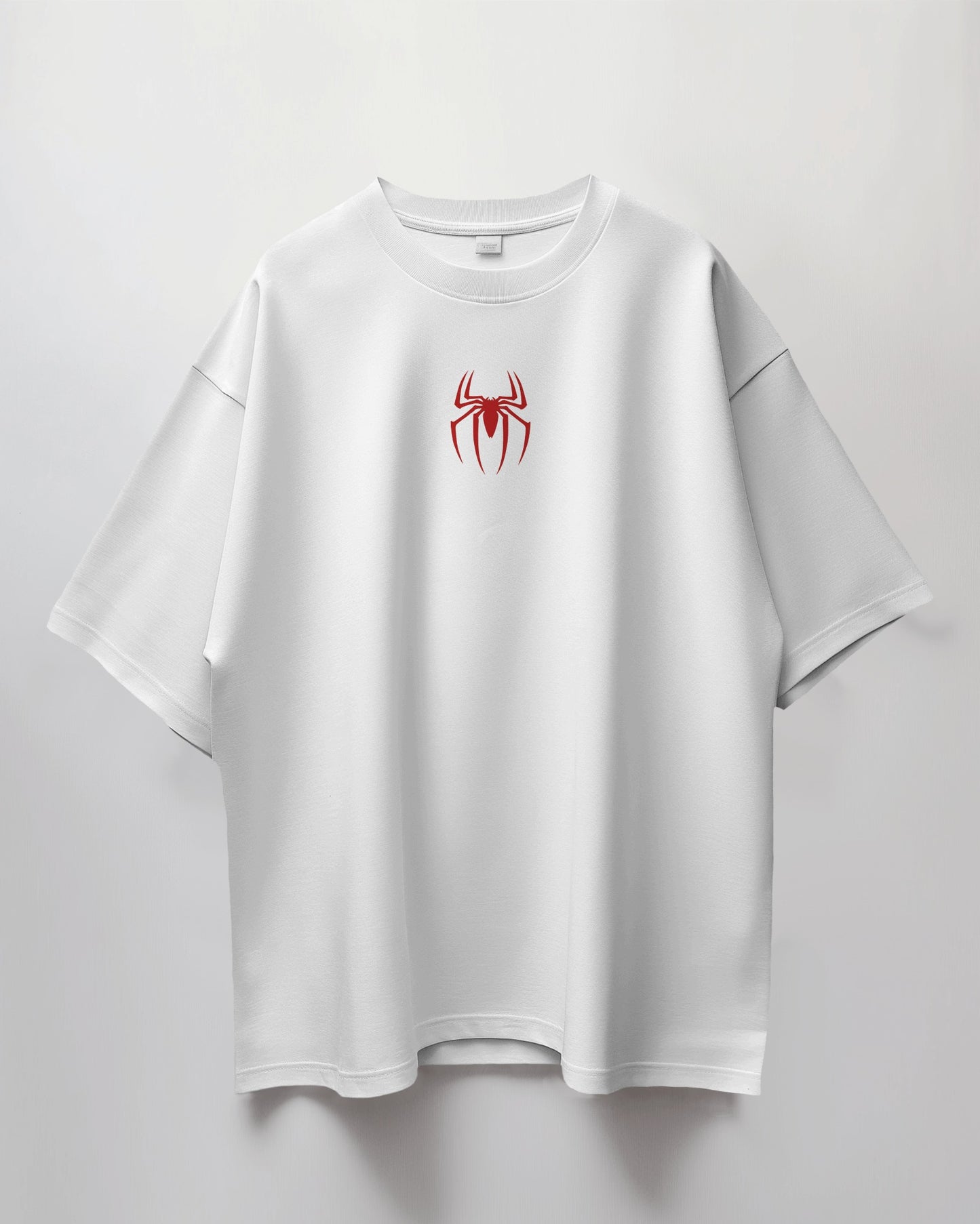 Colour_White t-shirt with a red spider logo on a light gray background