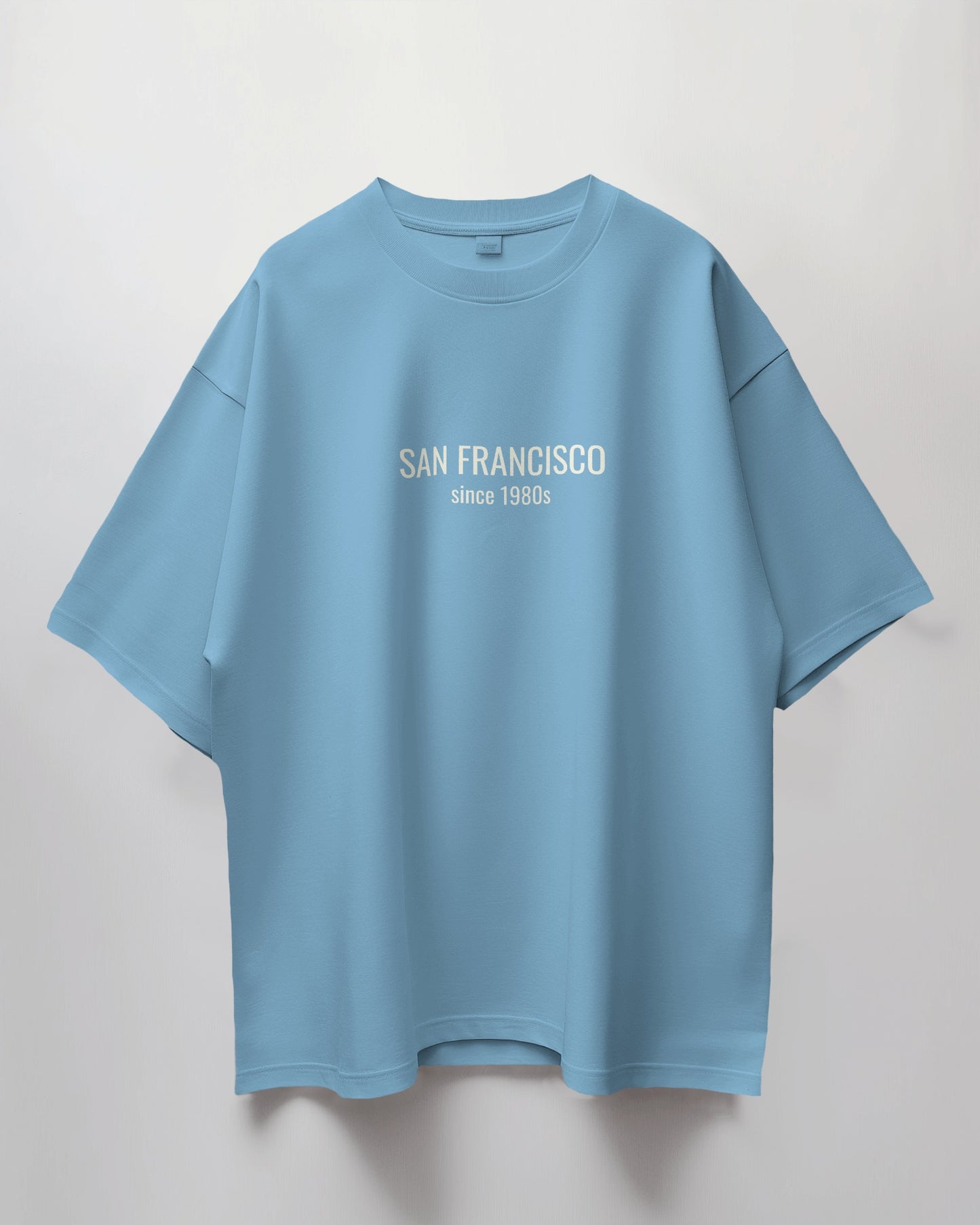 Light blue t-shirt with 'San Francisco since 1980s' text on a light gray background