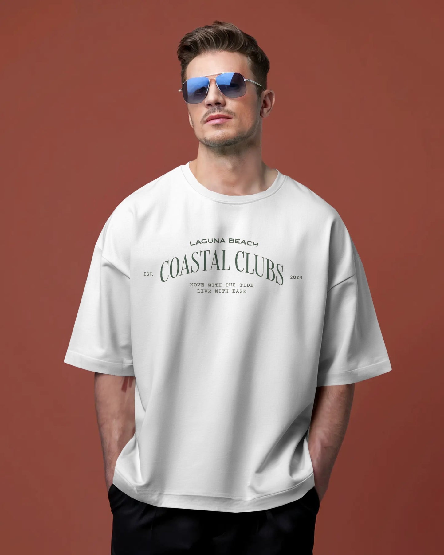 Man wearing a Colour_white t-shirt with text on a brown background