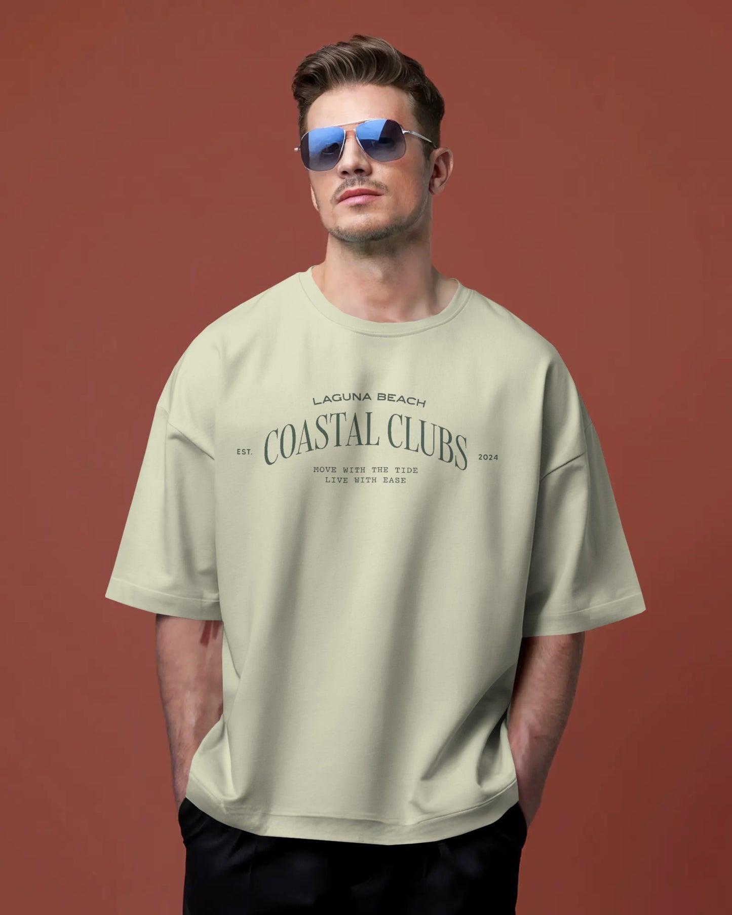 Man wearing a Colour_Off White t-shirt with text against a brown background