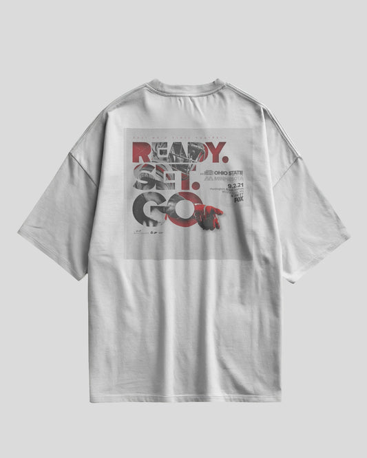 White oversized t-shirt with Ready Set Go graphic design on the back and Aethic Studios text on the front
