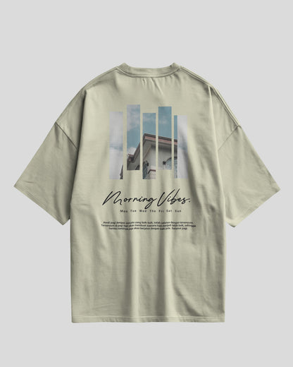 Light green t-shirt with photo collage and text on a white background