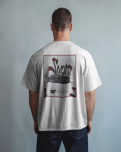 Person wearing a Colour_White t-shirt with a graphic design on the back against a plain background