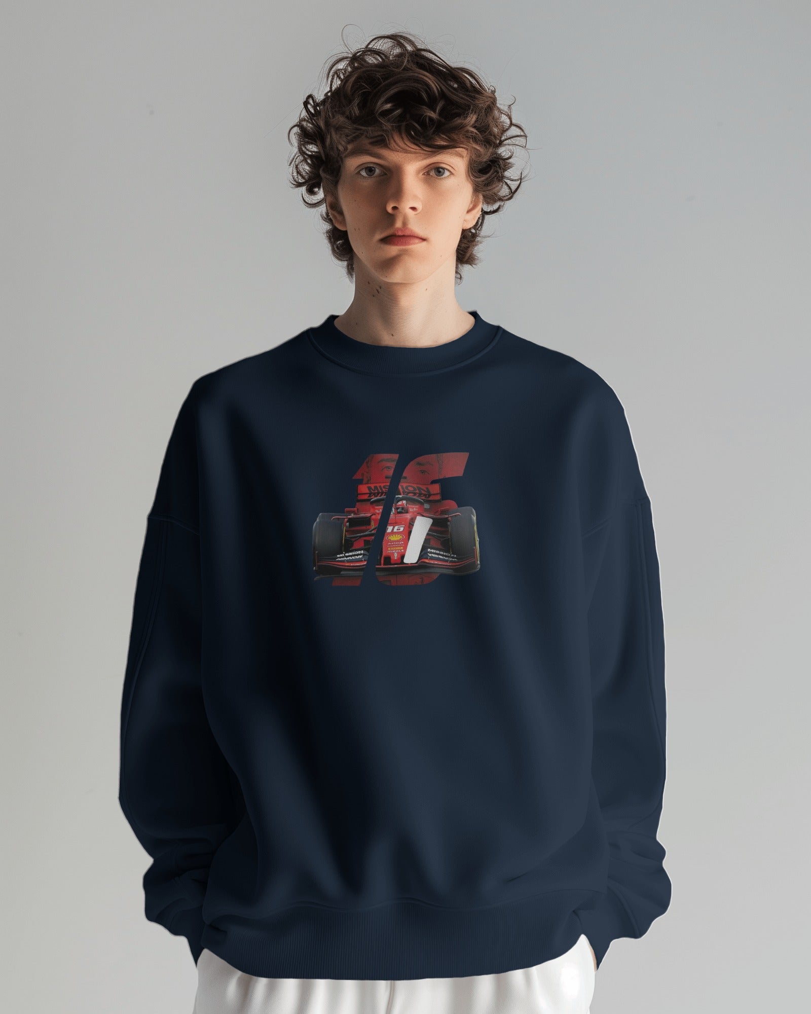 male model wearing navy racing graphic sweatshirt with bold F1 car design – Aethic Apparels streetwear