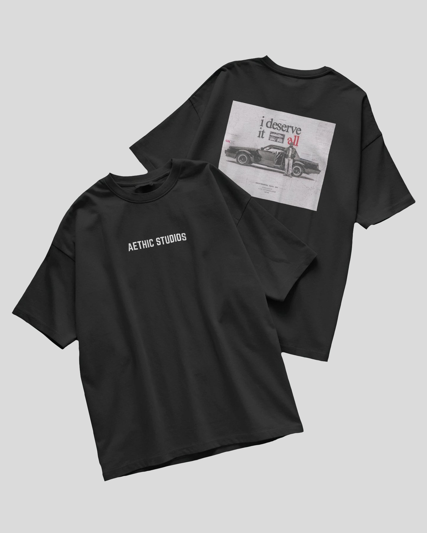 black oversized t-shirt with Attack Mode graphic and race car design on the back and Aethic Studios text on the front