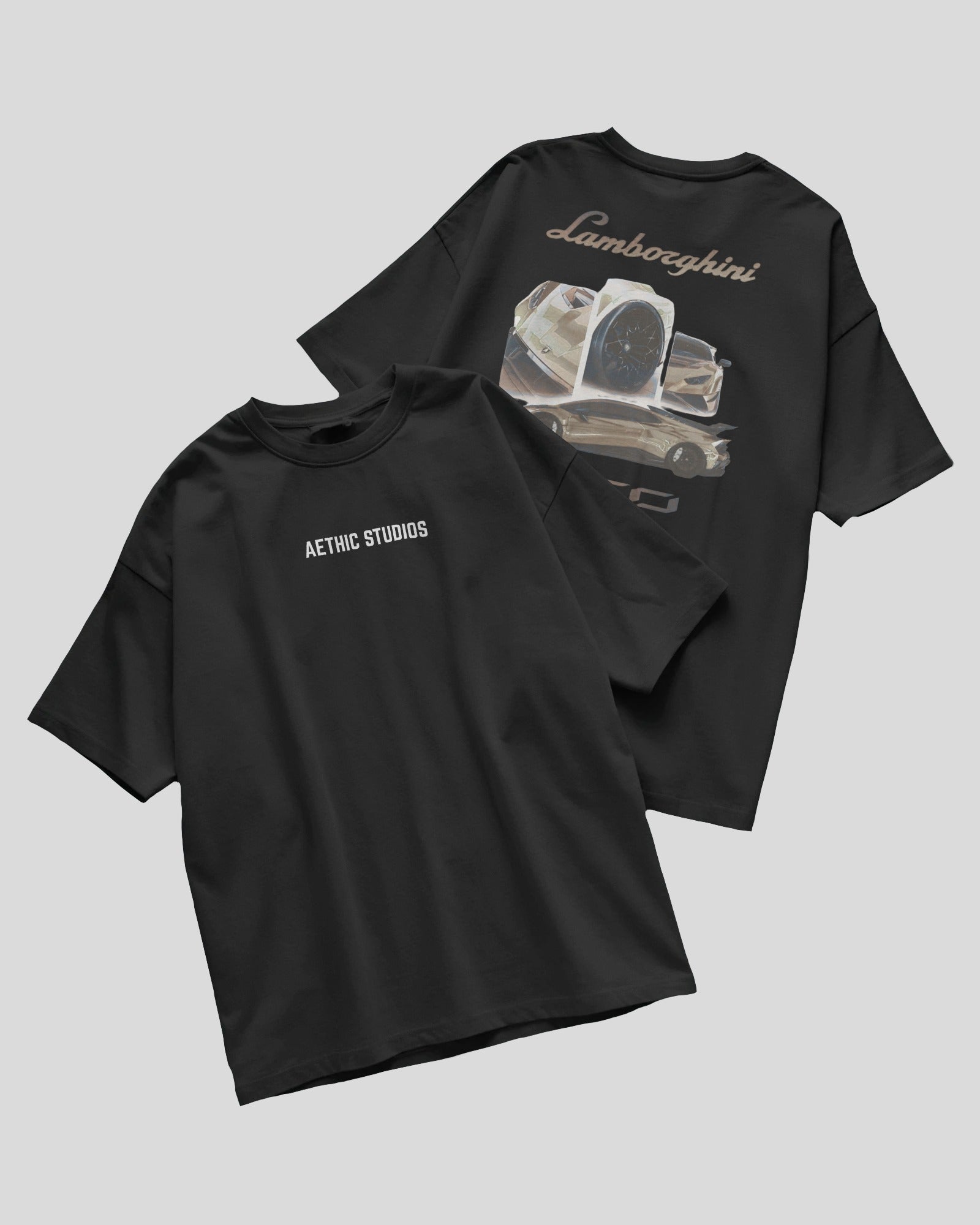 Two black t-shirts with graphic designs and text on a light gray background