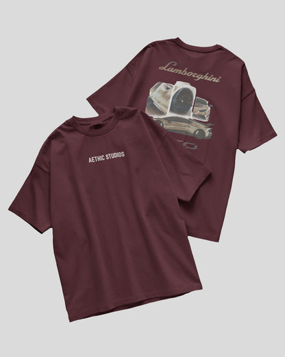 Two maroon t-shirts with graphic designs on a light gray background