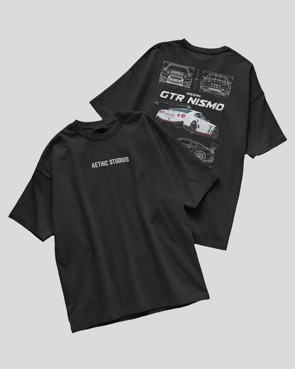 Two black t-shirts with car graphics and text on a gray background