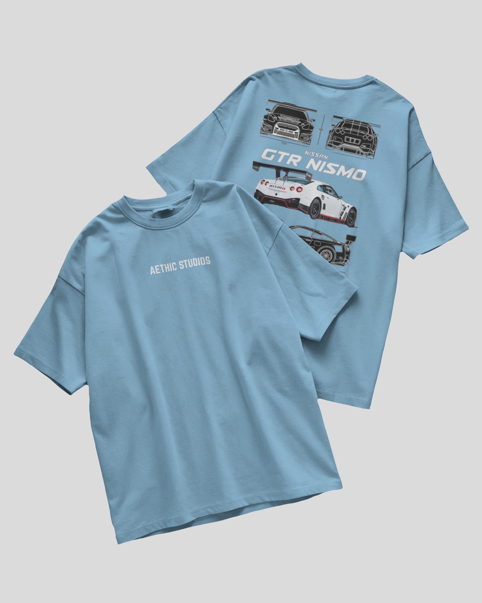 Light blue t-shirt with car graphics on a gray background