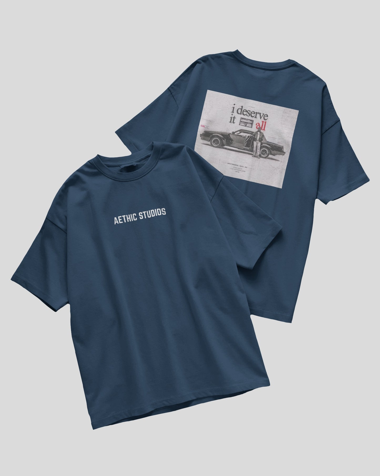 blue oversized t-shirt with Attack Mode graphic and race car design on the back and Aethic Studios text on the front