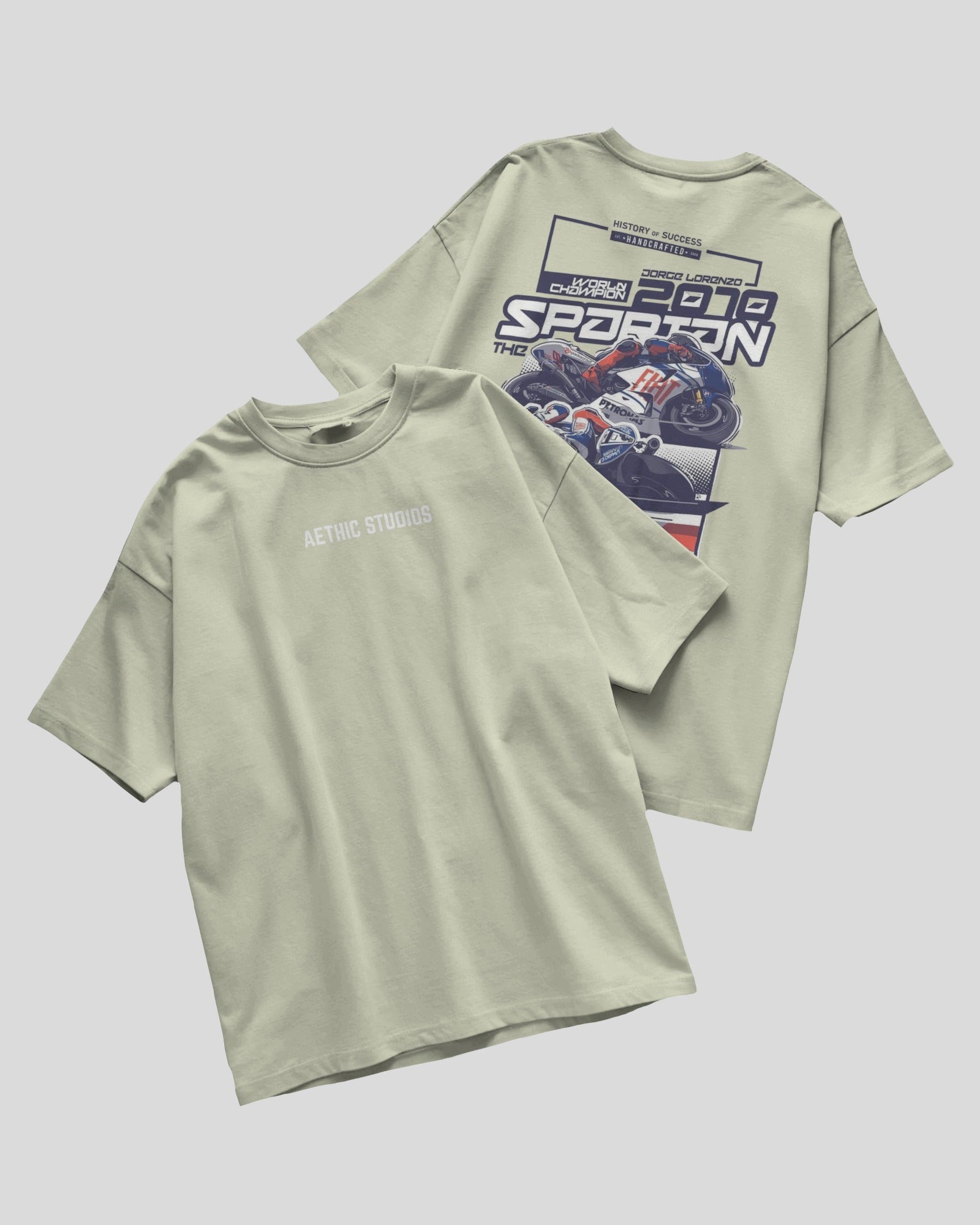Light green t-shirt with graphic design on a gray background