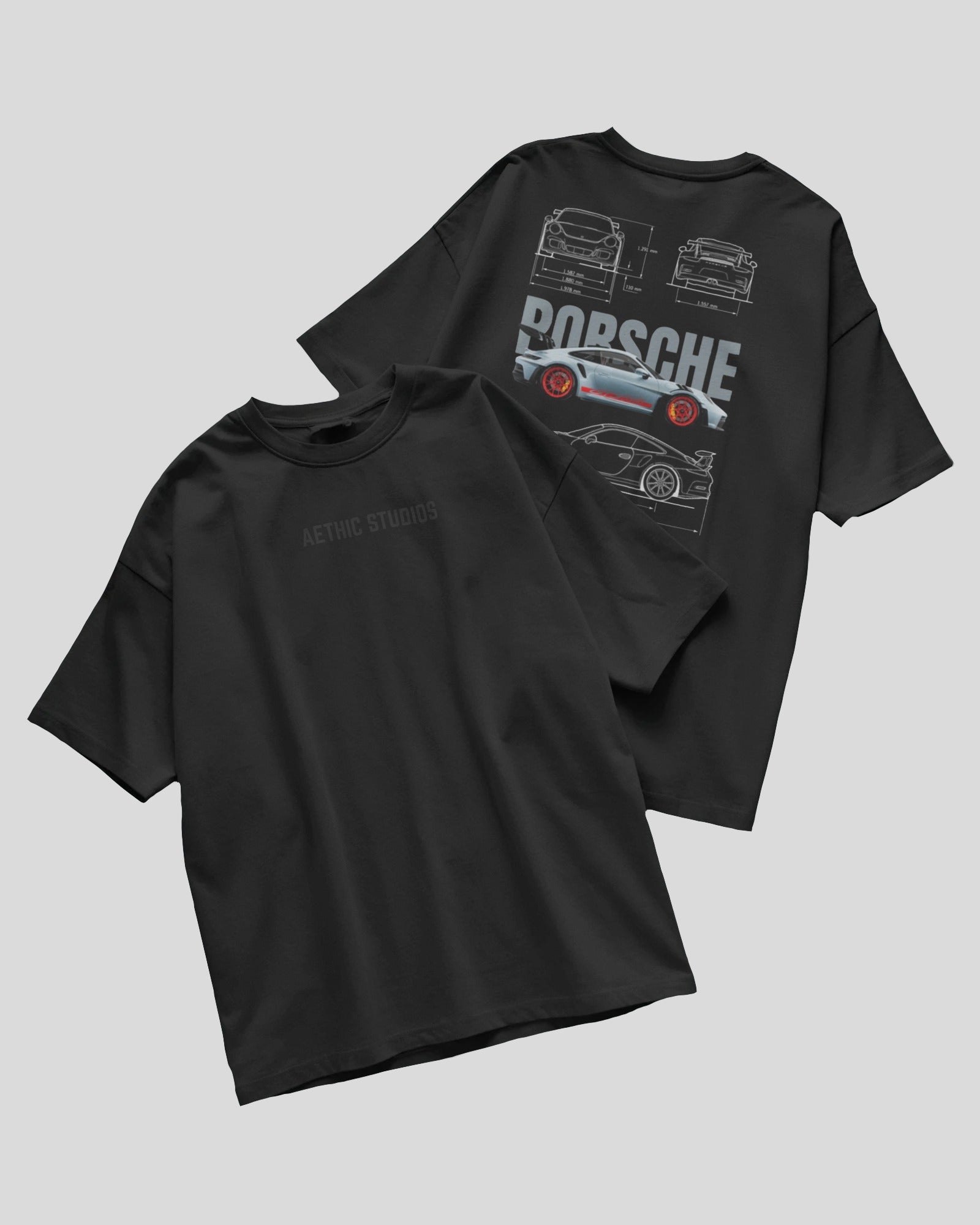 Black t-shirt with Porsche graphic on a gray background