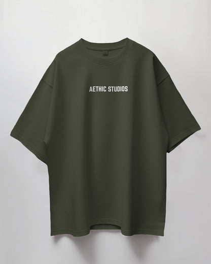 Green t-shirt with 'AETHIC STUDIOS' text on a white background