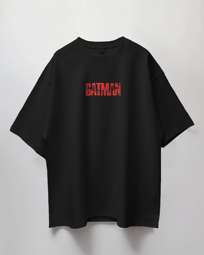 Black t-shirt with red 'BATMAN' logo on a light gray background