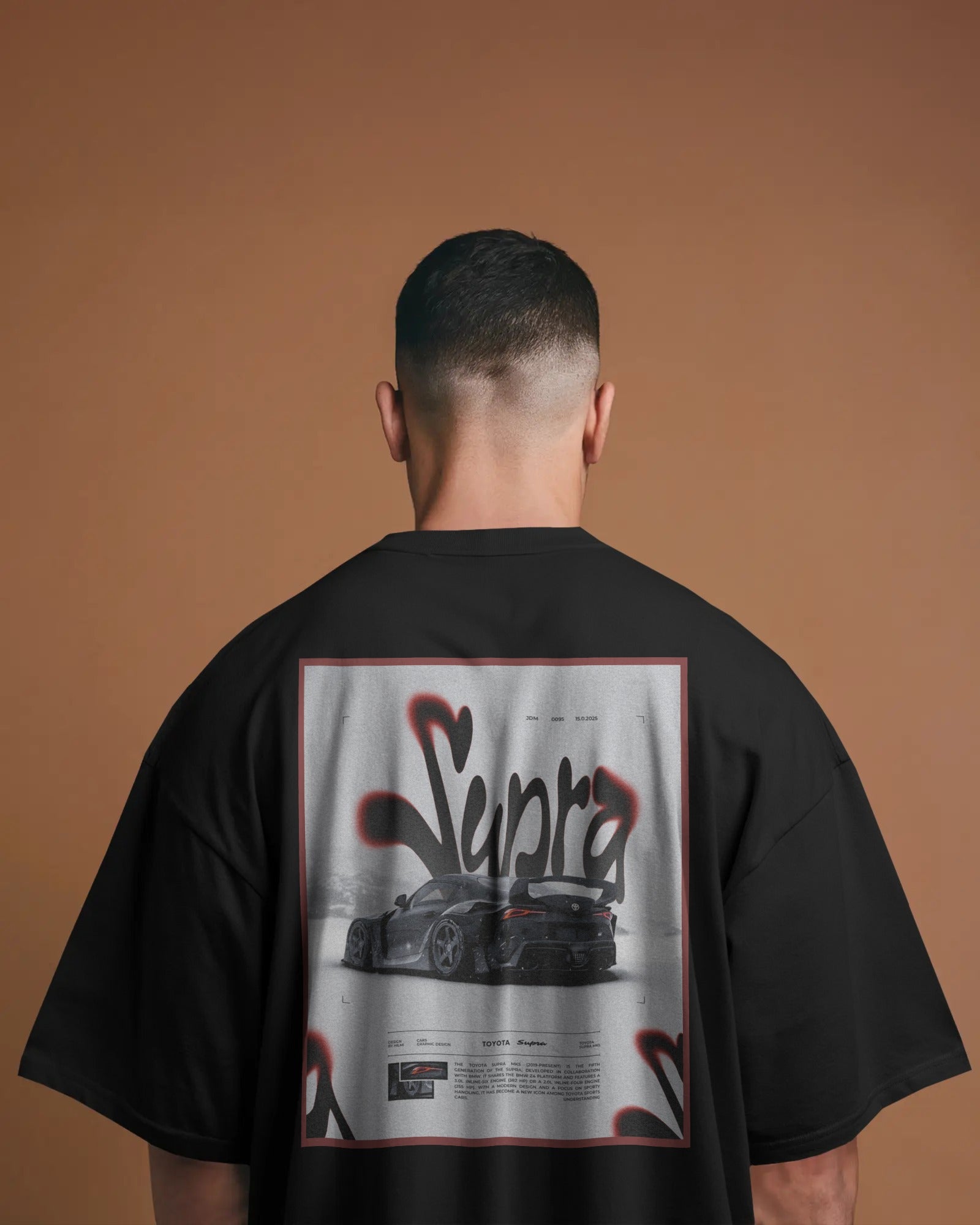 Person wearing a Colour_black t-shirt with 'Supra' graphic on the back against a brown background