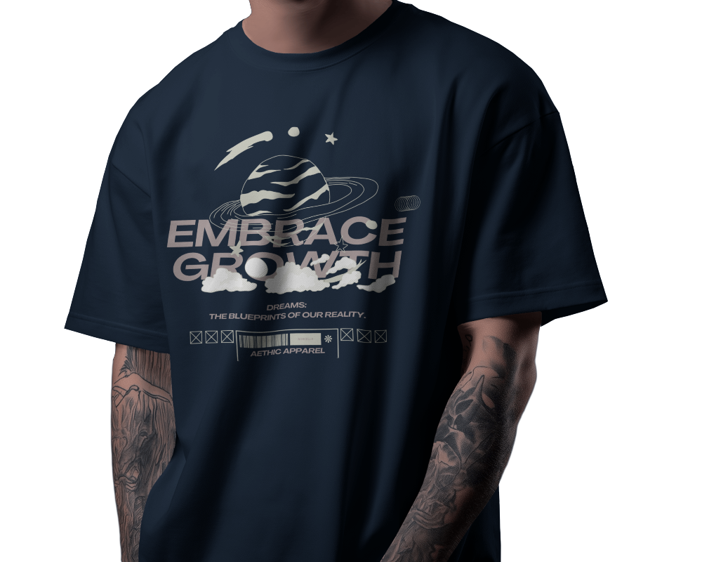 Person wearing a navy blue t-shirt with 'Embrace Growth' graphic design.