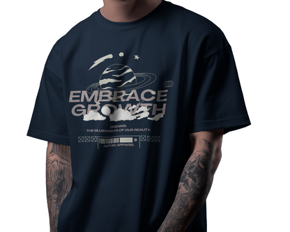 Person wearing a navy blue t-shirt with 'Embrace Growth' graphic design.
