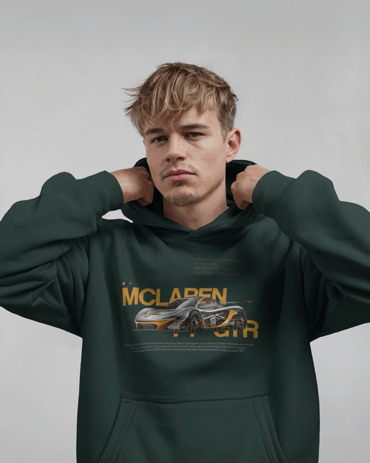 Person wearing a Colour_BottleGreen hoodie with McLaren logo on a gray background