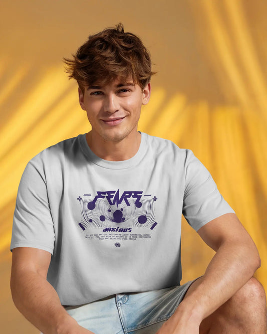 Person wearing a Colour_White t-shirt with a graphic design on a yellow background